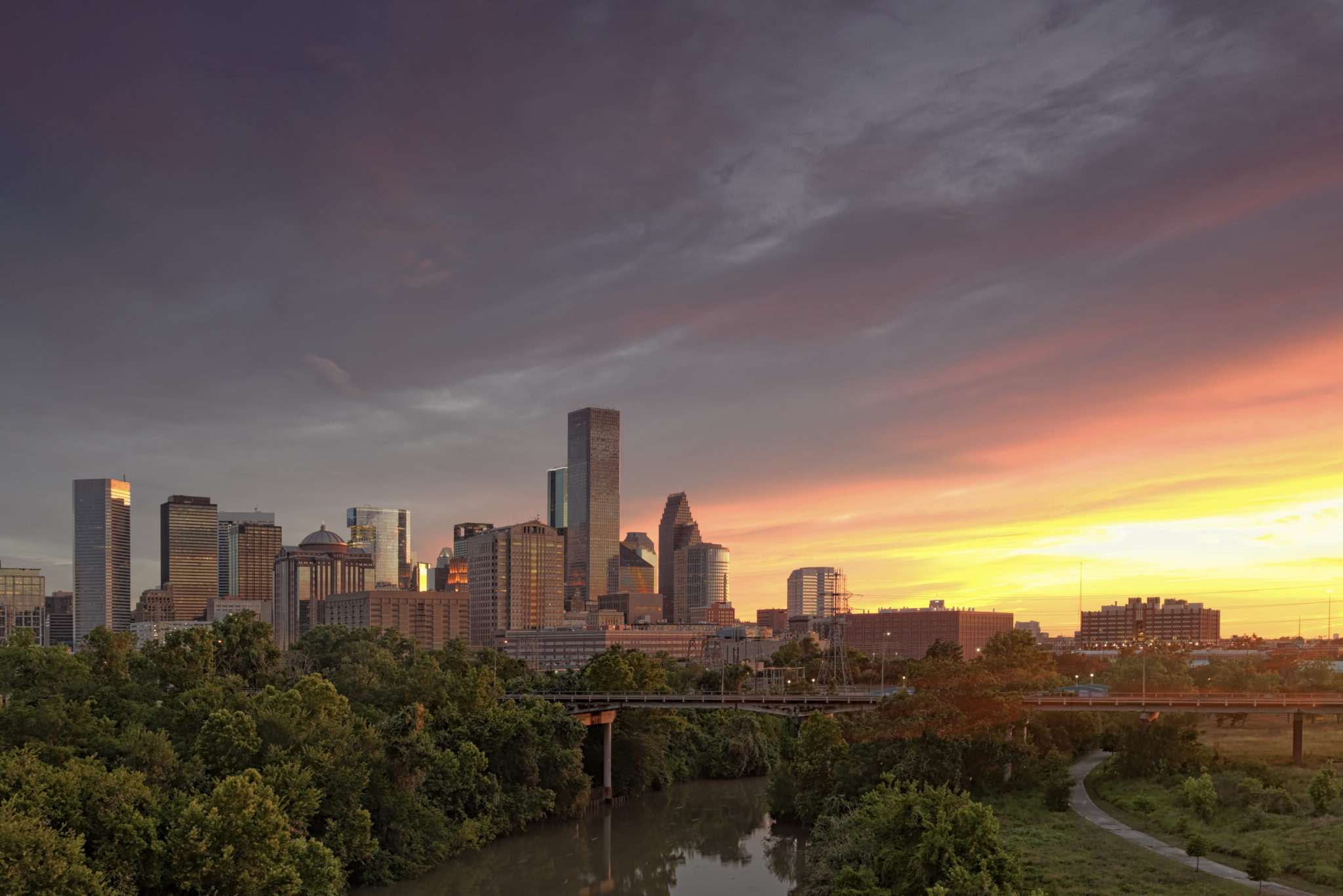 Houston skyline image via Shutterstock.