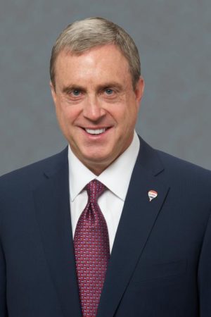 A headshot of Geoff Lewis
