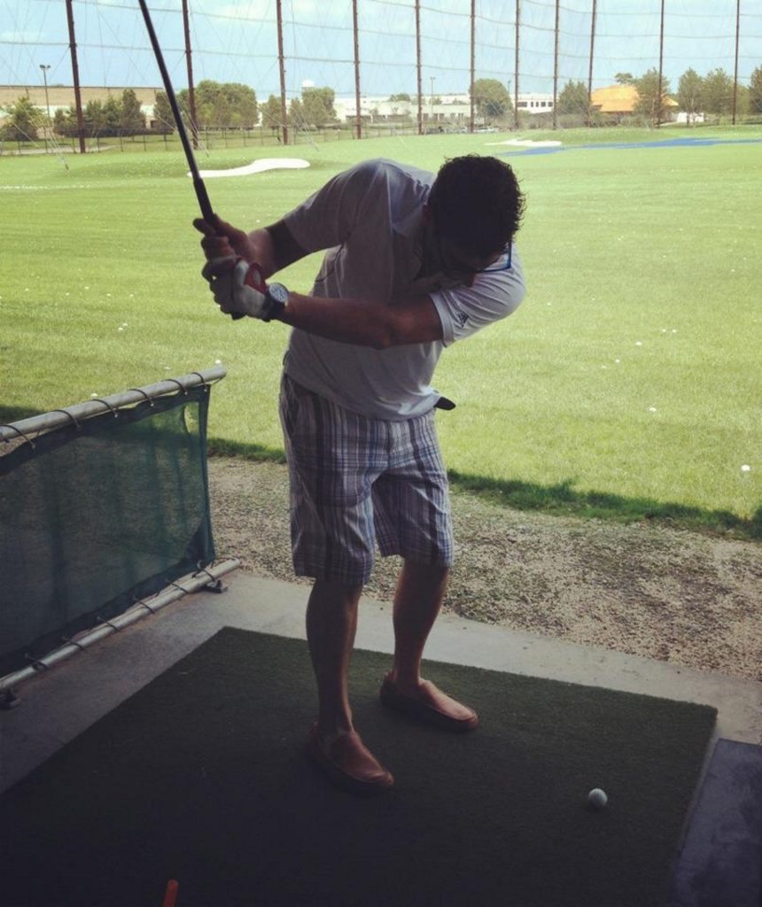 Anthony Mann playing golf.