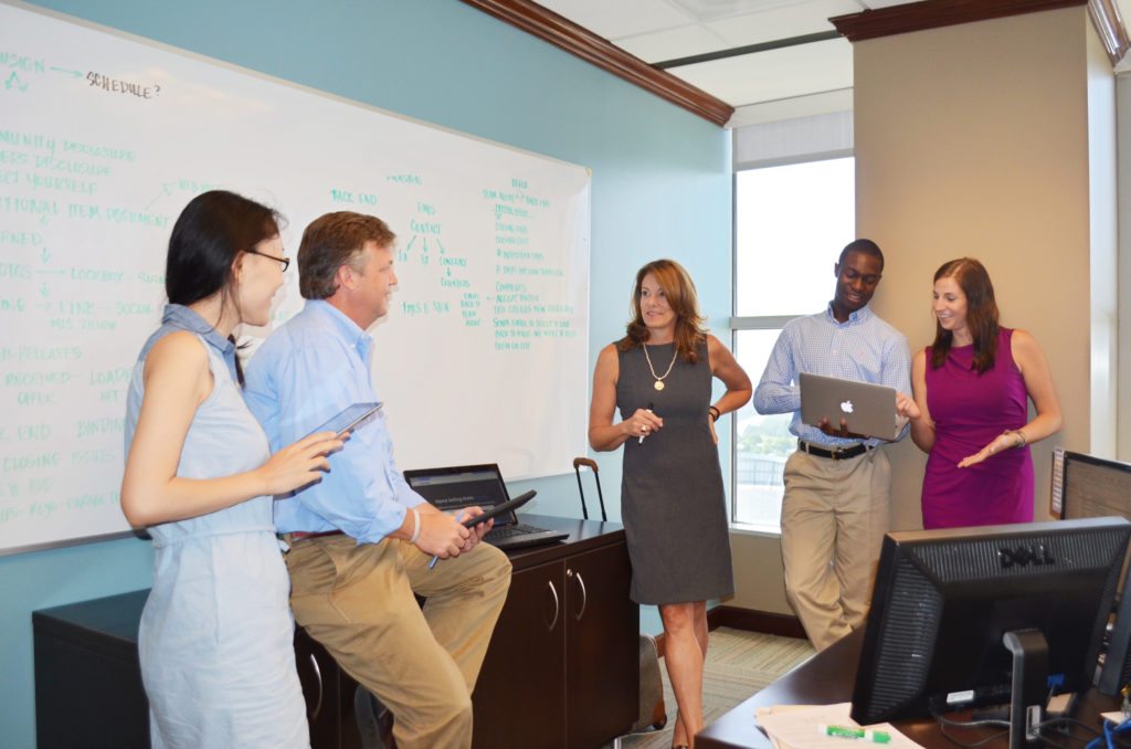 Left to right: Xi Li, Don Griffin, Jude Rasmus, Kenny Selmon and Kim Pope of Virgent Realty