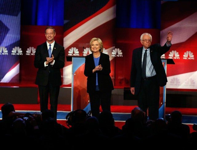 Democratic presidential candidate, former Maryland Gov. Martin O'Malley , left, Democratic presidential candidate, Hillary Clinton and Democratic presidential candidate, Sen. Bernie Sanders, I-Vt, stand together before the start of the NBC, YouTube Democratic presidential debate at the Gaillard Center, Sunday, Jan. 17, 2016, in Charleston, S.C. (AP Photo/Stephen B. Morton)