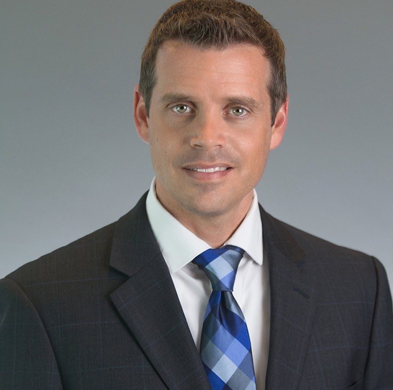 A headshot of Josh Tucker