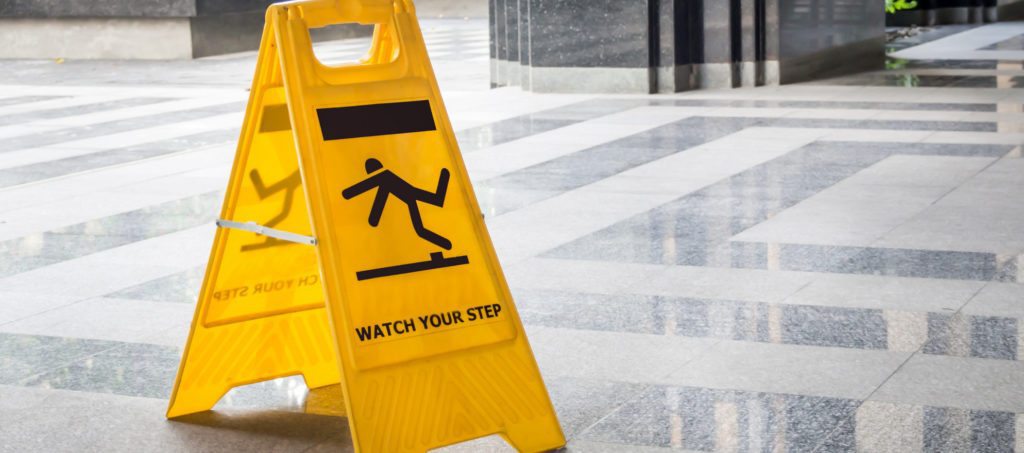 A "watch your step" sign with a figure slipping