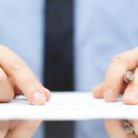A man examining a contract closely