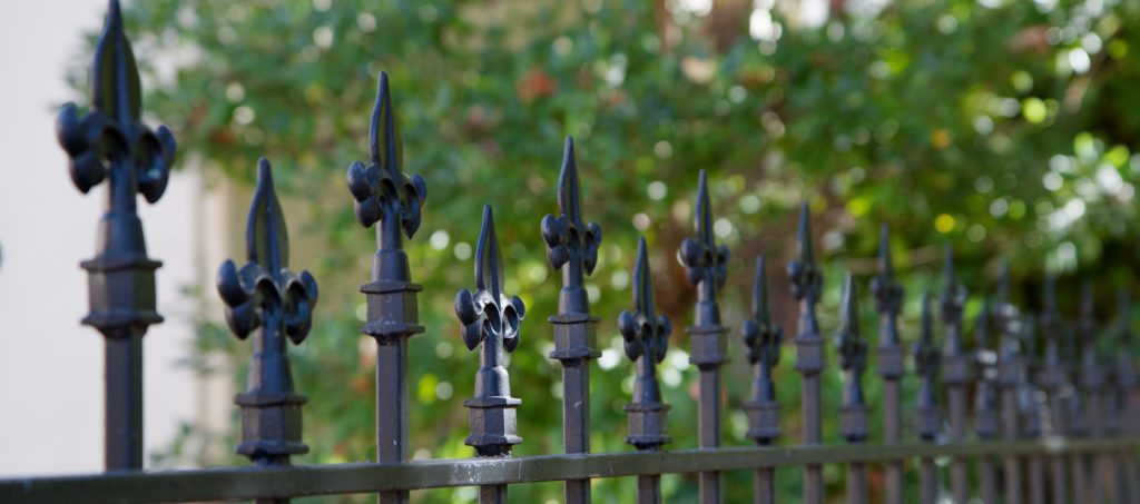 A gated fence around a park