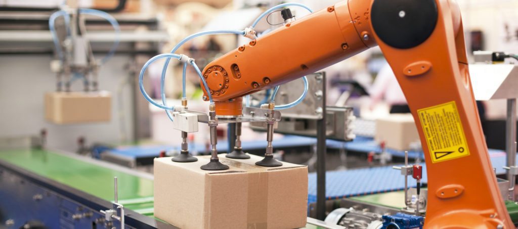 A robotic arm sealing up a package