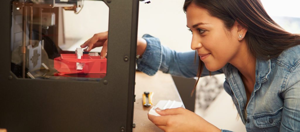 An architect printing on a 3-D printer.