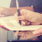 A group of people taking notes