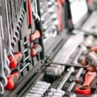 A man's hands selecting tools