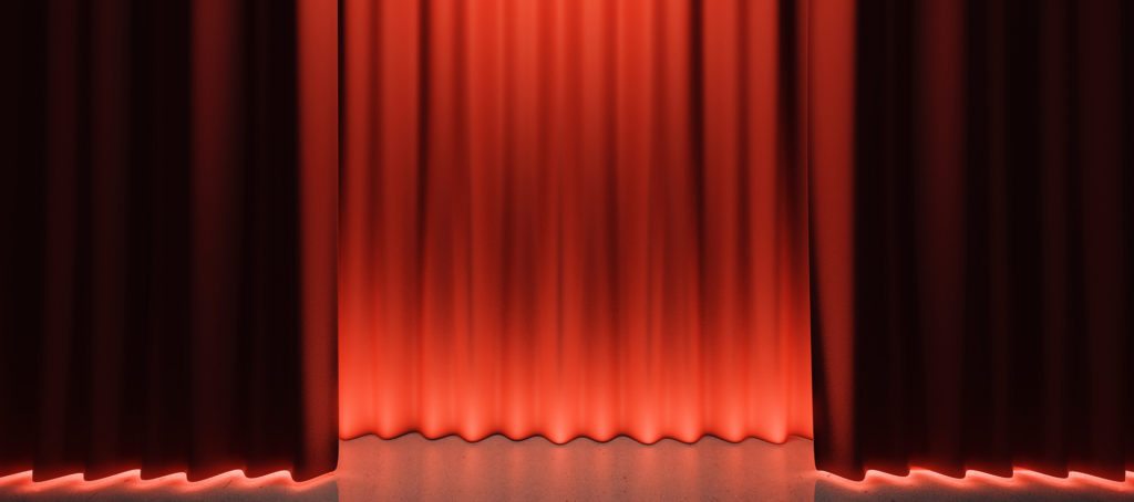 Curtains opening on a stage