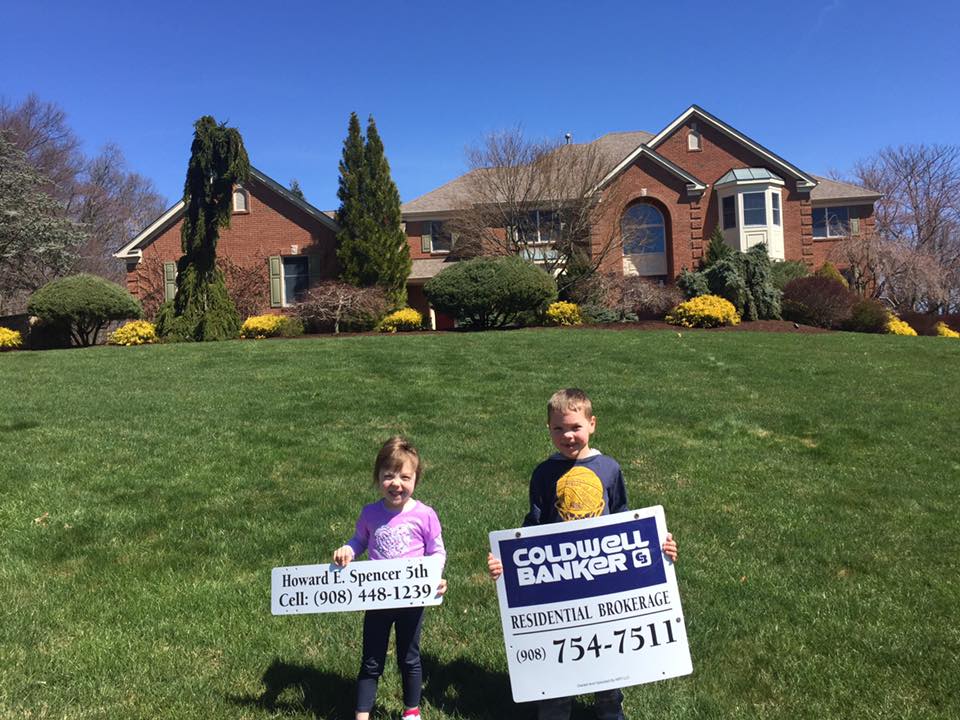 'The kids love putting up signs with me,' says Frenchtown, New Jersey-based Realtor Howard Spencer.