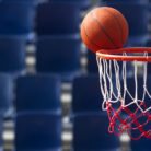 A basketball just missing the basket