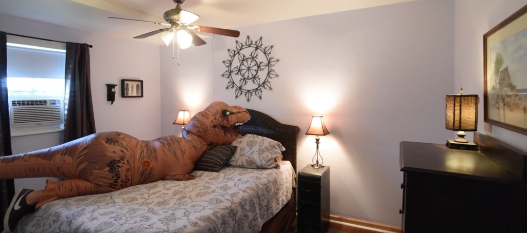 A giant T. rex costume is helping this real estate agent sell a home